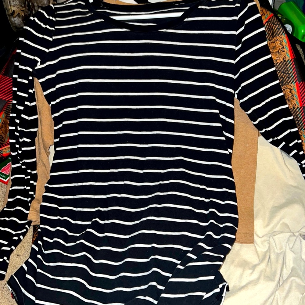 A small but fits med to large bump maternity shirt